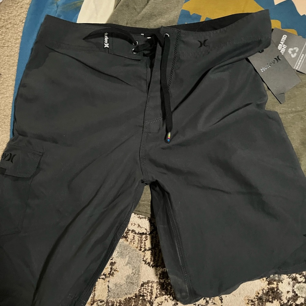 Hurley black board shorts swim suite 32x22, never worn, with tags still on.